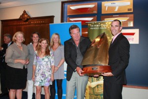 (from left to right) Jan Dawson (presenting trophy on behalf of Yachting New Zealand) and crew members Emma Hendy, Rhonda McCrea, Jackie Hendy, George Hendy and Stu Bannatyne